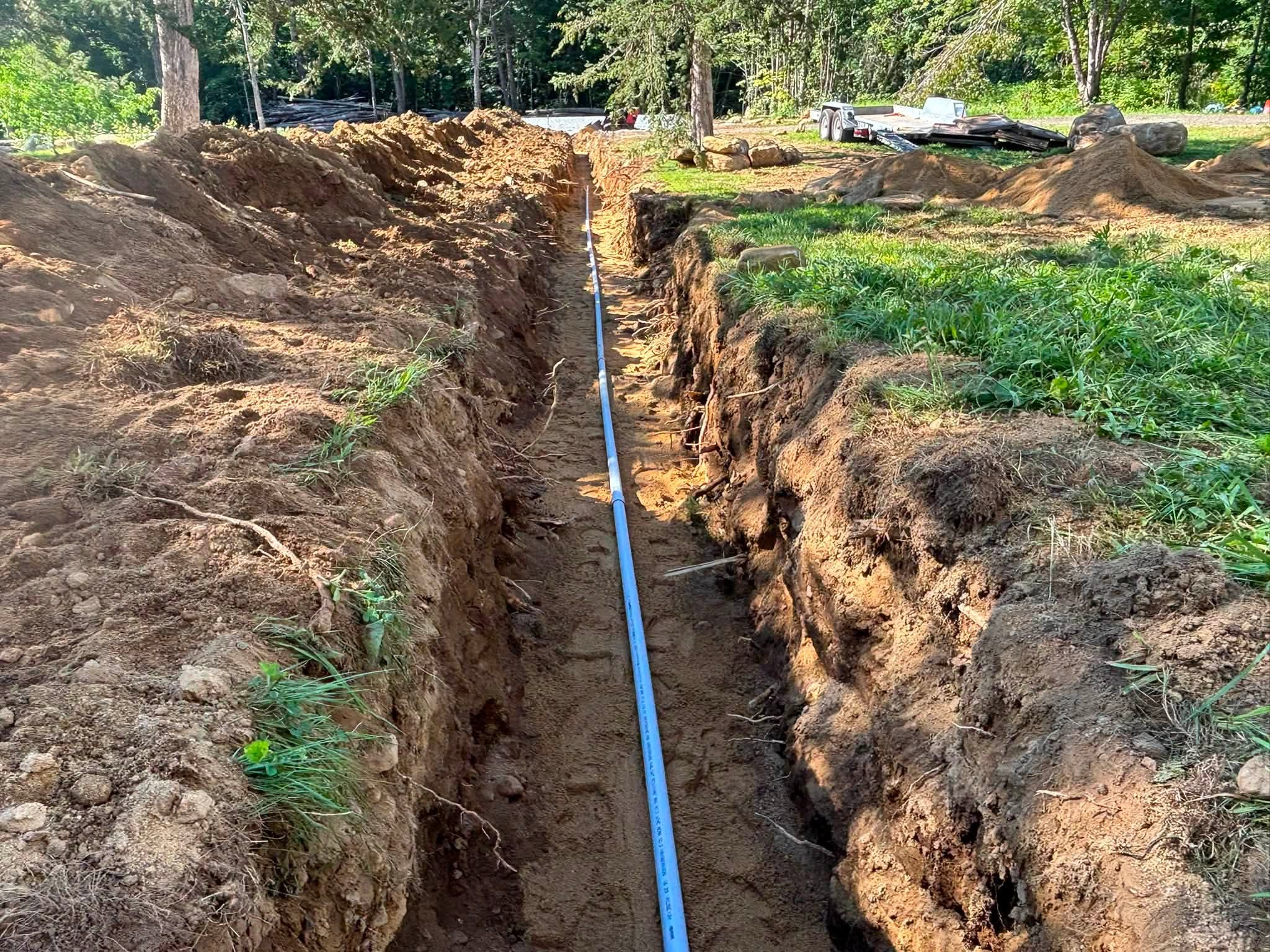 Completed 200-foot water service and electrical conduit trench — Brimfield, MA — Lavallee Landscaping